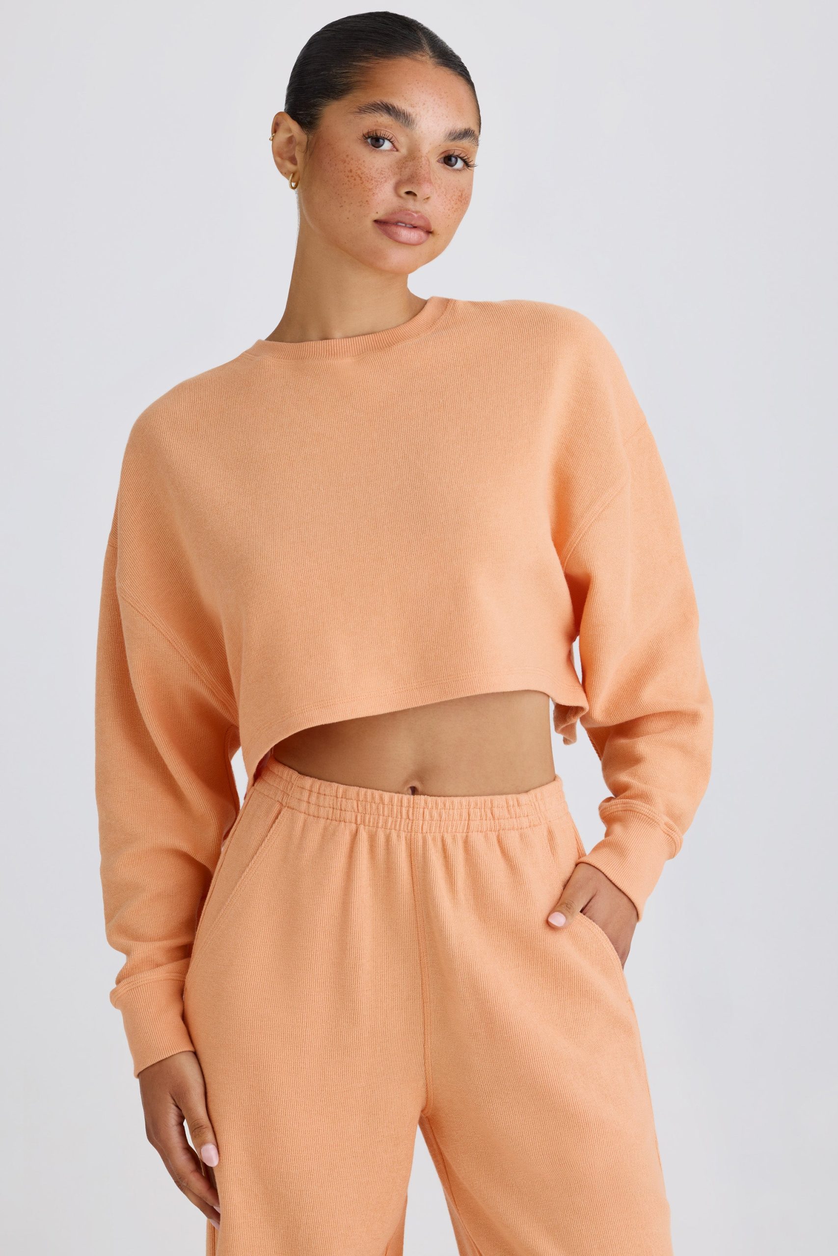 Textured Cotton Jersey Open-Back Cropped Sweatshirt in Peach - Image 6